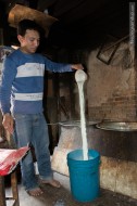 man pouring milk