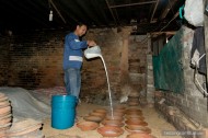 man pouring milk