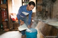 man pouring milk